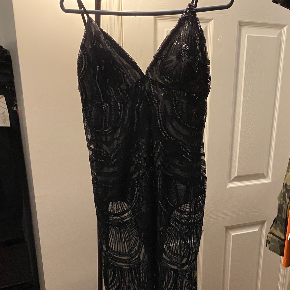Beautiful sequin black dress new without tags ..